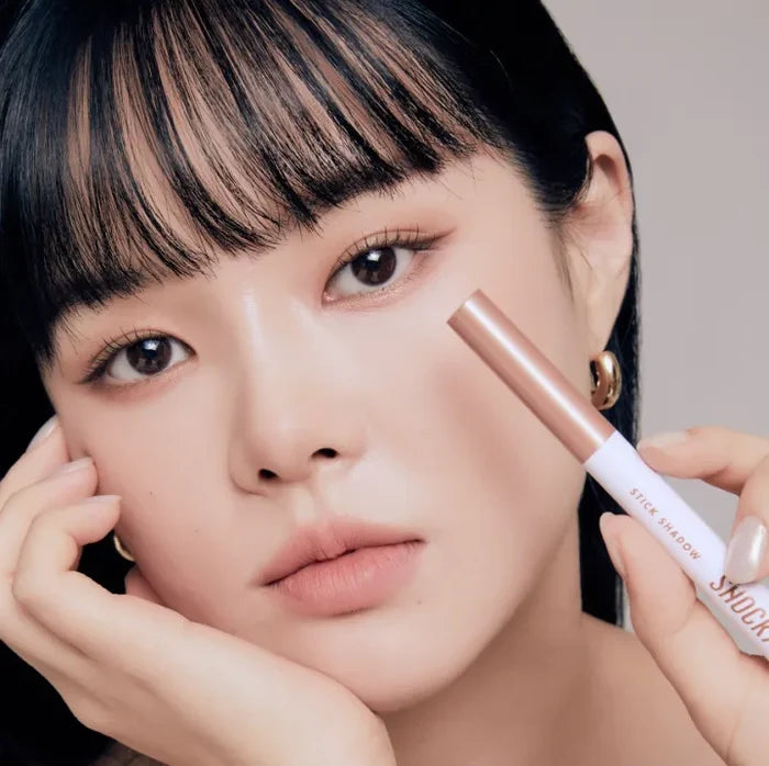 Model demonstrating TONY MOLY The Shocking Color Fixing Stick Shadow for eye makeup.