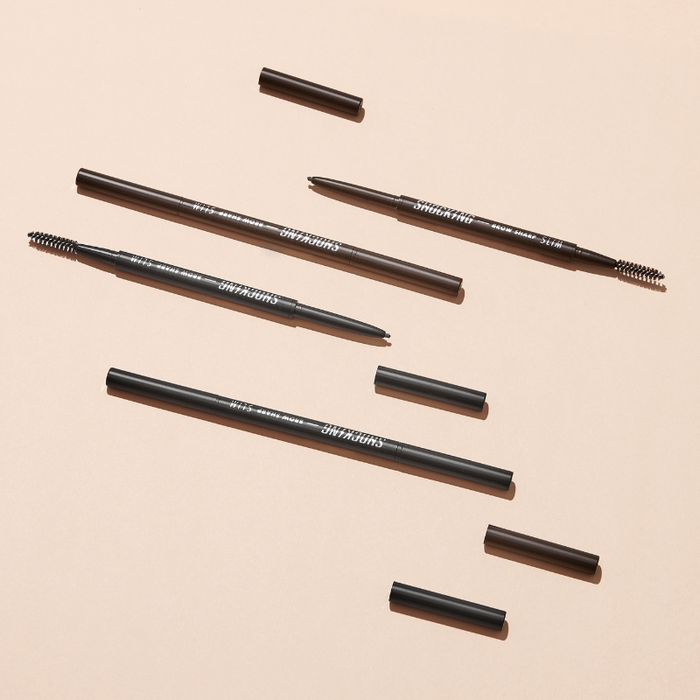 TONY MOLY The Shocking Vegan Brow Sharp Slim eyebrow pencils on a beige background.