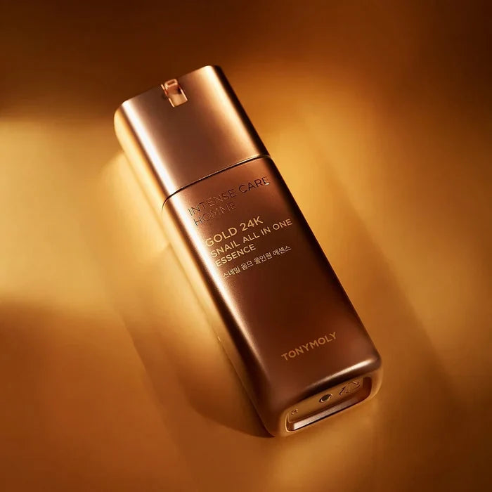 TONYMOLY Intense Care Gold 24K Snail Homme All-in-One Essence 130ml bottle on gold background for Gentleman Korea, Korean men’s skincare product
