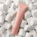 TONYMOLY Marshmallow Melting Cream 30g tube surrounded by marshmallows, highlighting unique skincare product in texture and design