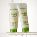 TONYMOLY Wonder Vegan Label Ceramide Mochi Midly Acidic Gel Foam 180g tubes with green caps on a wet surface.