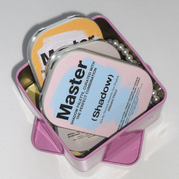 TOOQ Master Piece Face Shadow Palette in pink box showcasing elegant design and vibrant colors for makeup enthusiasts.