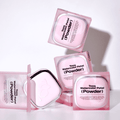 TOOQ Water Color Petal Powder packaging with multiple pink boxes stacked and open, showcasing the elegant design.