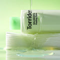 TORRIDEN Balanceful Peeling Toner 250ml bottle with liquid pouring, highlighting the product's hydrating and exfoliating properties.