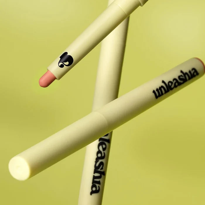 UNLEASHIA Oh! Happy Day Lip Pencil on a green background