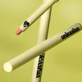 UNLEASHIA Oh! Happy Day Lip Pencil on a green background