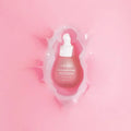 URANG Pink Everlasting Ampoule surrounded by a pink splash design