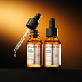 Two bottles of WELLAGE Hyper Toning Glow Ampoule 30ml with a dropper on a dark background.