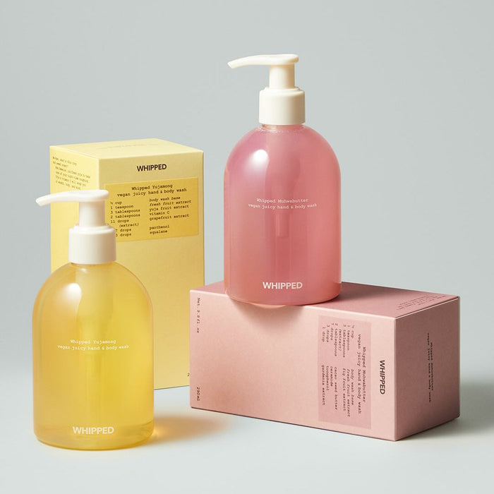 Two bottles of WHIPPED Yujamong Vegan Juicy Hand & Body Wash 290ml with packaging.