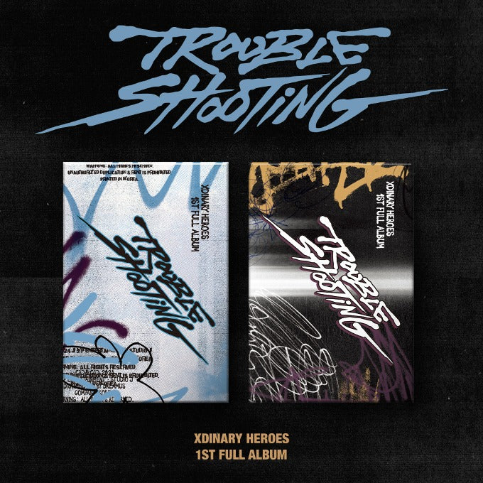 Cover of XDINARY HEROES 1st Album Troubleshooting (Random Ver.) featuring artistic graffiti designs.