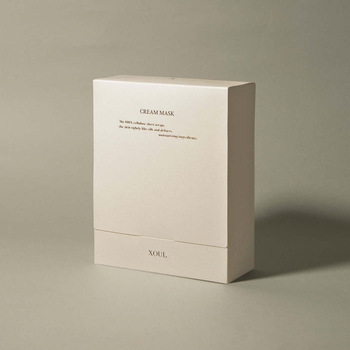 XOUL Secret Solution Cream Mask 15p packaging with beige box showcasing product design and branding features in ambient lighting.