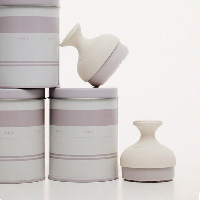 XOUL Silky Smoothing Cleansing Ball next to elegant packaging, showcasing luxury skincare product design.